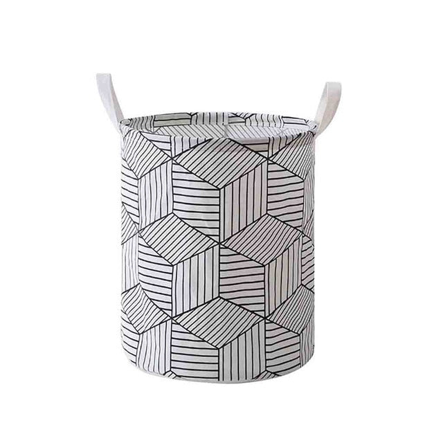 VibeCore Foldable Abstract Laundry Basket in black geometric pattern on a white backdrop, featuring a large-capacity, waterproof, and dustproof design with reinforced handles.
