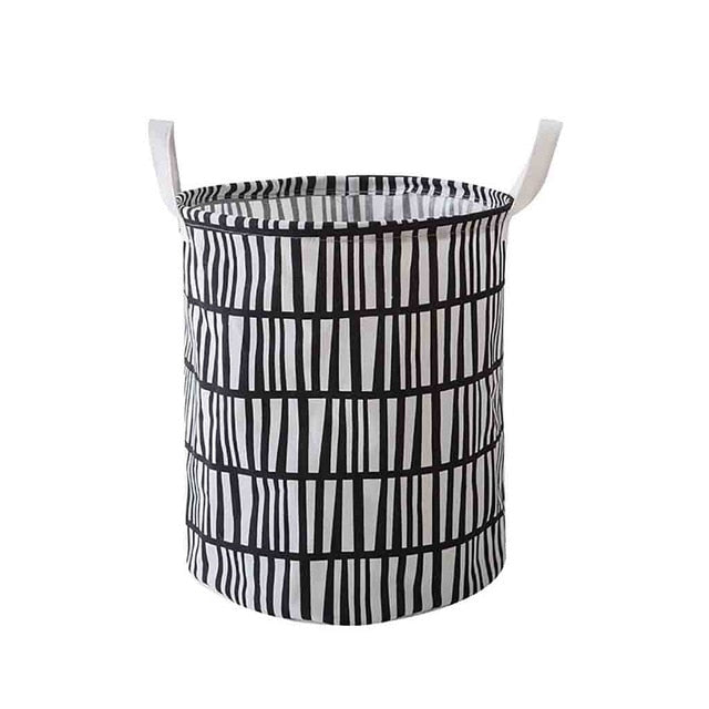VibeCore Foldable Abstract Laundry Basket in black lines pattern on a white backdrop, featuring a large-capacity, waterproof, and dustproof design with reinforced handles.
