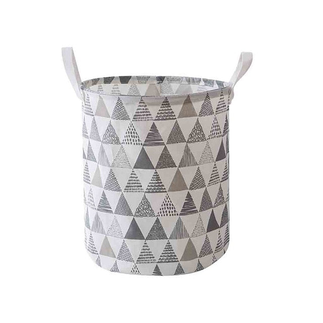 VibeCore Foldable Abstract Laundry Basket in grey triangle pattern on a white backdrop, featuring a large-capacity, waterproof, and dustproof design with reinforced handles.
