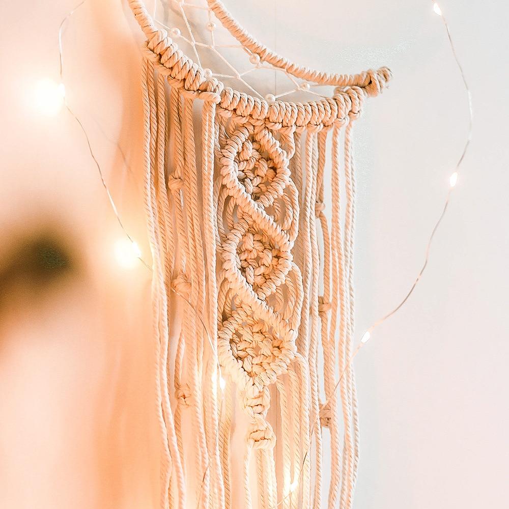 VibeCore Handmade Macrame Moon Wall Hanging close-up of the moon's tassels, highlighting the detailed craftsmanship and natural cotton threads that add a boho-chic touch.