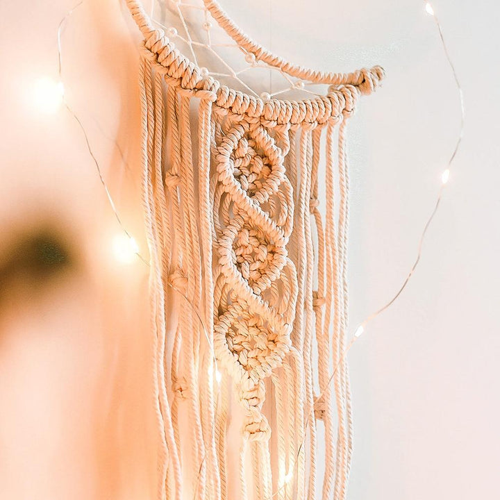 VibeCore Handmade Macrame Moon Wall Hanging close-up of the moon's tassels, highlighting the detailed craftsmanship and natural cotton threads that add a boho-chic touch.