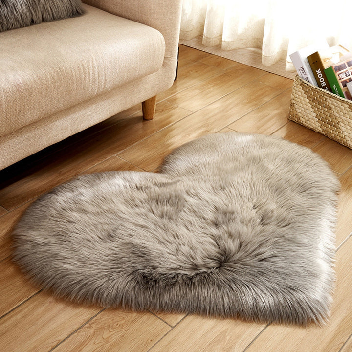 VibeCore Heart-Shaped Accent Rug in light gray, featuring a soft, faux sheepskin texture with a cozy, non-slip backing, ideal for bedrooms, dorms, or living spaces.