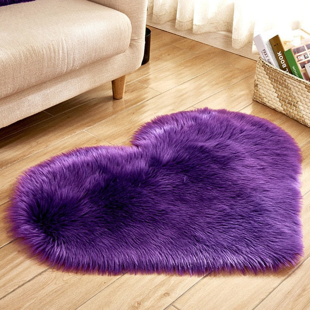 VibeCore Heart-Shaped Accent Rug in purple, crafted from soft faux sheepskin with a non-slip backing, ideal for adding a cozy and vibrant touch to any room's decor.