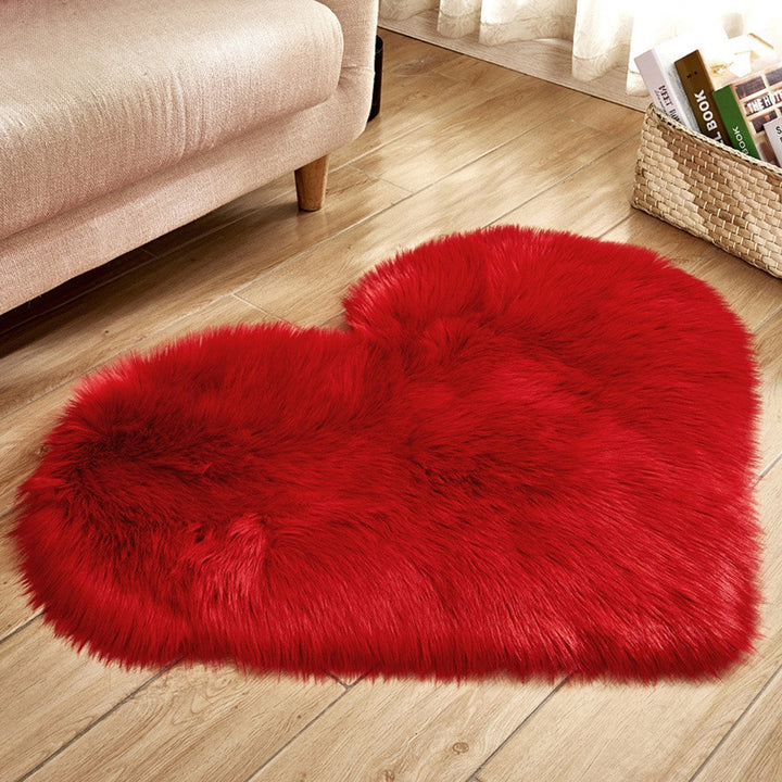 VibeCore Heart-Shaped Accent Rug in red, featuring a soft faux sheepskin texture with a non-slip backing, ideal for adding a bold and cozy touch to bedrooms, dorms, or living spaces.