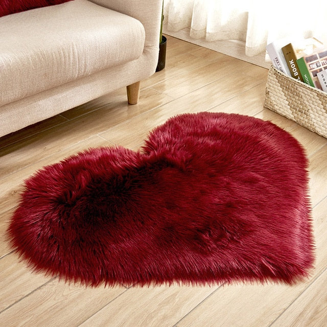 VibeCore Heart-Shaped Accent Rug in wine red, featuring a plush faux sheepskin texture with a non-slip backing, perfect for adding warmth and elegance to bedrooms, dorms, or living spaces.