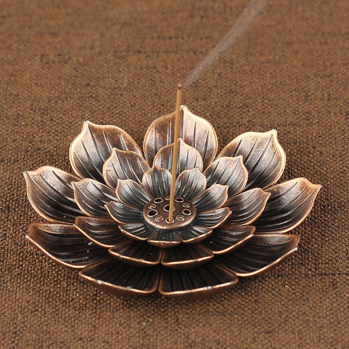 VibeCore Lotus Incense Holder with 3-layer lotus design made of durable zinc alloy, featuring 5 holes for multiple incense sticks or cones, designed for a zen atmosphere and easy to clean.