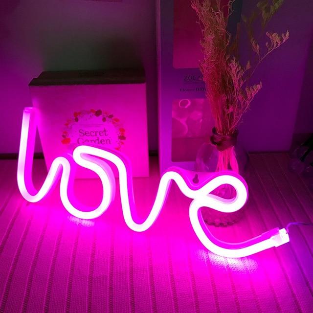 Aesthetic VibeCore Love Neon Light in pink, USB or battery-powered LED sign for trendy bedroom, dorm, or lounge decor, creating a warm, romantic glow to elevate your space.