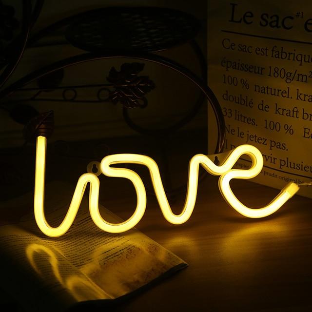 Aesthetic VibeCore Love Neon Light in warm white, USB or battery-powered LED sign for trendy bedroom, dorm, or lounge decor, creating a warm, romantic glow to elevate your space.