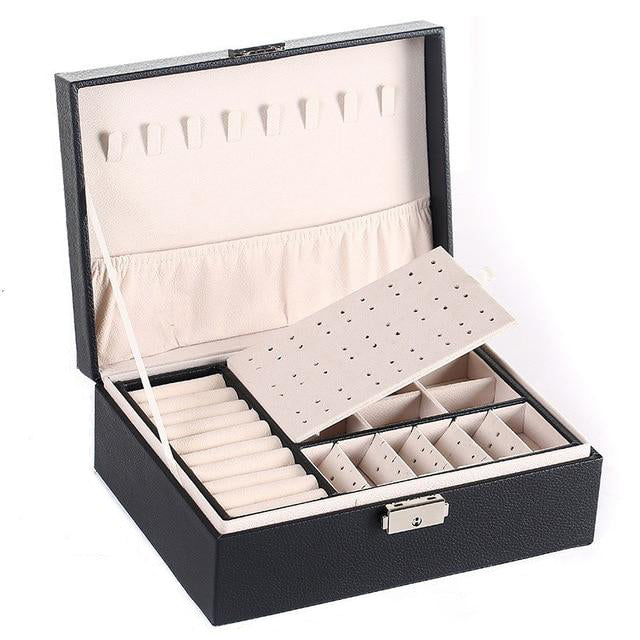 VibeCore Multi-Layer Jewelry Box in Black – sleek, lockable design with two layers and bonus top storage. Ample space for organizing rings, necklaces, and earrings. Perfect for travel, everyday use, and a thoughtful gift for any occasion.