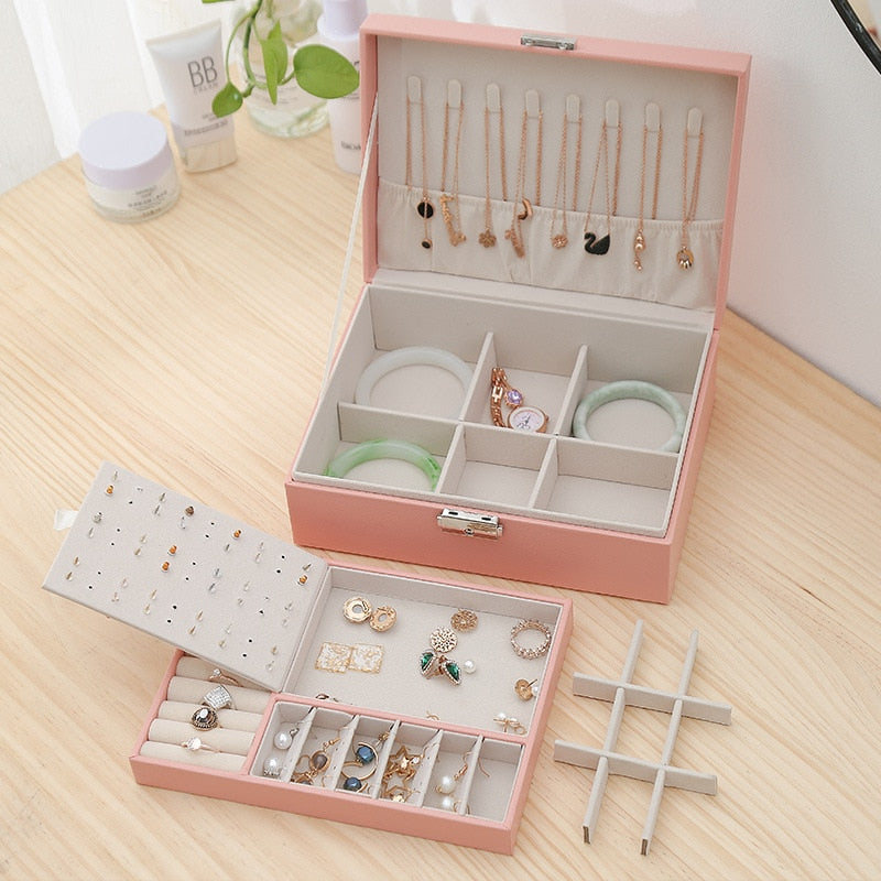 VibeCore Multi-Layer Jewelry Box in Blossom, featuring all storage compartments, including sections for rings, necklaces, earrings, and more. The sleek, lockable design with a removable layer offers ample space for organizing jewelry, making it perfect for travel or everyday use.