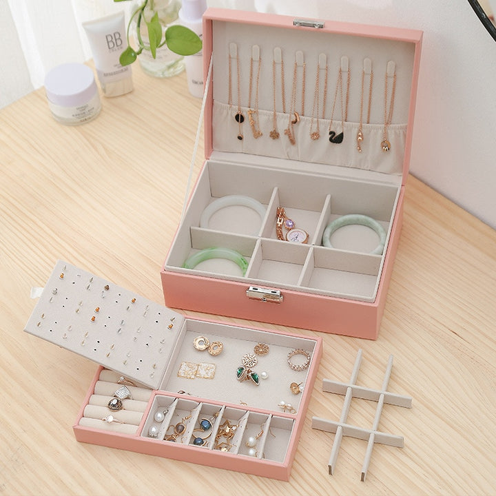 VibeCore Multi-Layer Jewelry Box in Blossom, featuring all storage compartments, including sections for rings, necklaces, earrings, and more. The sleek, lockable design with a removable layer offers ample space for organizing jewelry, making it perfect for travel or everyday use.