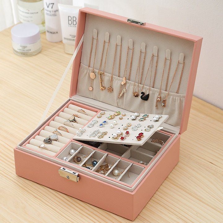 VibeCore Multi-Layer Jewelry Box in Blossom, open view, showcasing its sleek, lockable design with two layers and bonus top storage. Ample space for organizing rings, necklaces, earrings, and more, with a removable layer for flexible storage. Perfect for everyday use and travel.