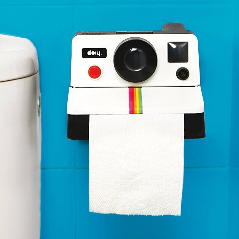 VibeCore Polaroid Toilet Paper Holder mounted on the wall, showcasing its retro camera design and functional bathroom decor.