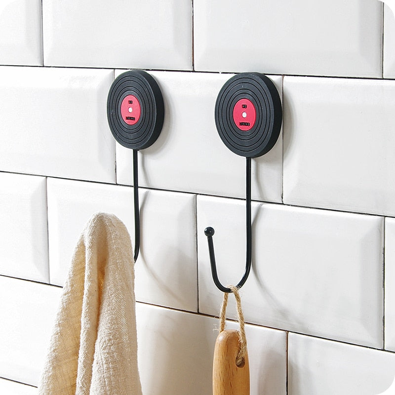 VibeCore Retro Wall Hook featuring two vinyl records installed on a wall, showcasing their nostalgic design as functional hooks for hanging items like coats and bags.