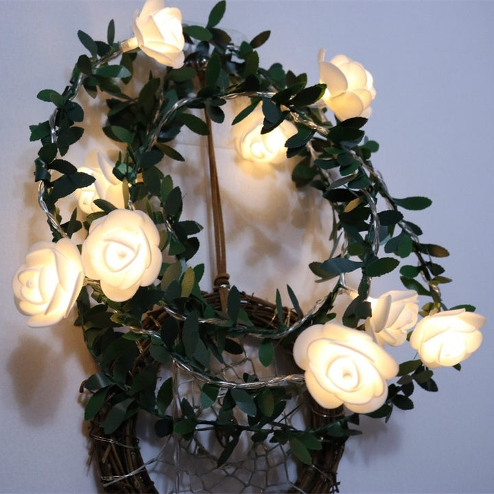 VibeCore rose flower string lights hung on the wall, creating a soft, cozy glow that adds a vibrant and charming touch to the space.