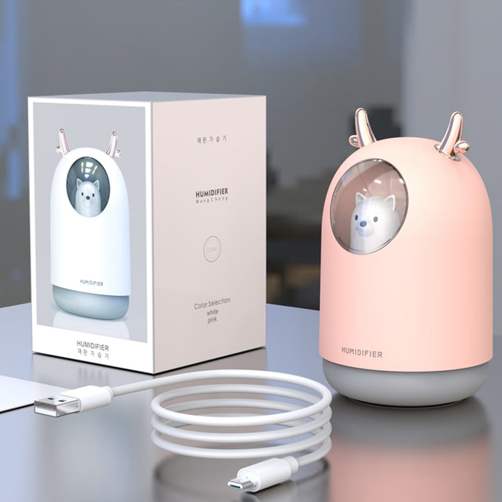 VibeCore Space Dog Humidifier Blossom package contents, including the humidifier unit, USB charging cable, user manual, and optional essential oil tray for enhanced aromatherapy experience.