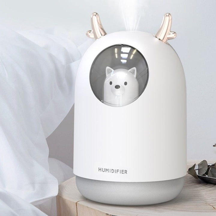 VibeCore Space Dog Humidifier White on side table, featuring a cute design with colorful mood lighting and essential oil compatibility, adding charm and a refreshing atmosphere to your space.