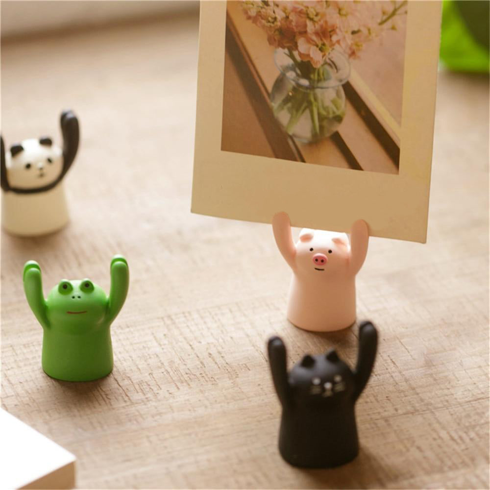 VibeCore Tiny Animal Photo Holder Cat, Frog, Panda, and Piggy, each holding a photo, adding a whimsical touch to any space with their adorable and functional designs.
